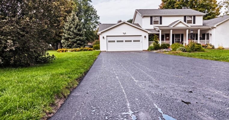 Home with asphalt driveway