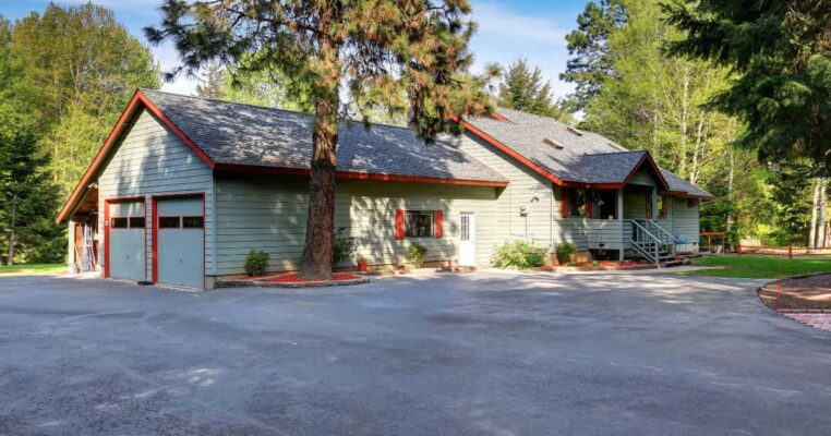 Home with 2 car garage and asphalt driveway