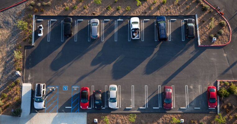 Cars parked on asphalt parking lot
